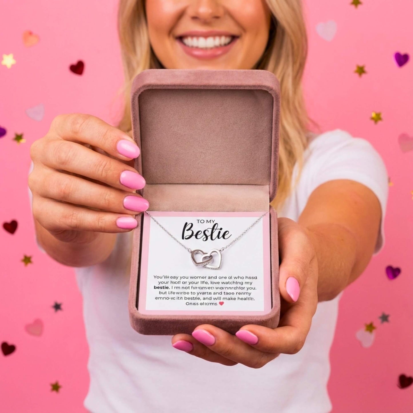 Point of view holding the open To My Bestie gift box, showing the necklace and emotional message card.